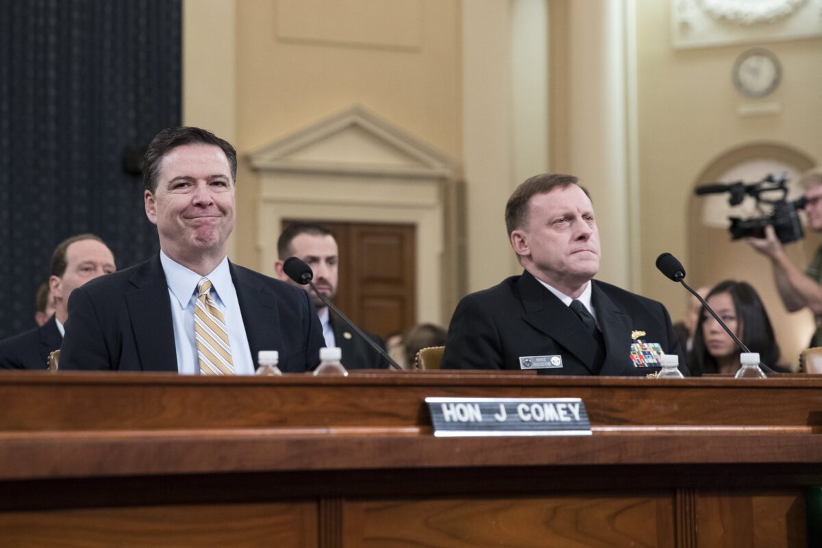 epa05860145 FBI Director James Comey (L) and National Security Agency Director Mike Rogers (R) prior to testifying before the House Select Intelligence Committee hearing on Russian active measures during the 2016 election campaign on Capitol Hill in Washington, DC, USA, 20 March 2017. EPA/SHAWN THEW